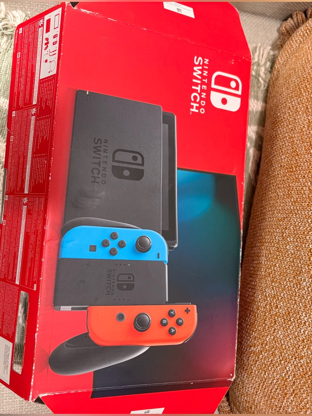 Nintendo Switch with Neon Blue and Neon Red Joy‑Con Controllers